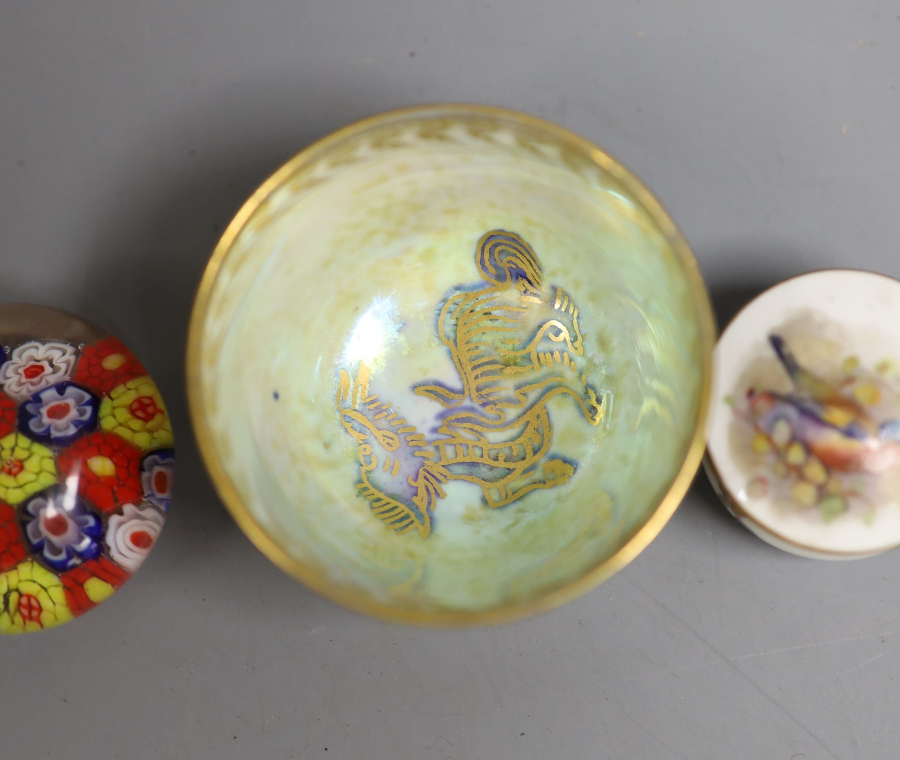 A Wedgwood lustre small cup, 4cm high, two Royal Worcester 'bird' pots & covers and three glass millefiori paperweights.